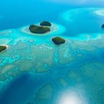 Aerial view of Raja Ampat islands and turquoise waters.