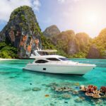 Luxury yacht sailing Raja Ampat's turquoise waters and islands.